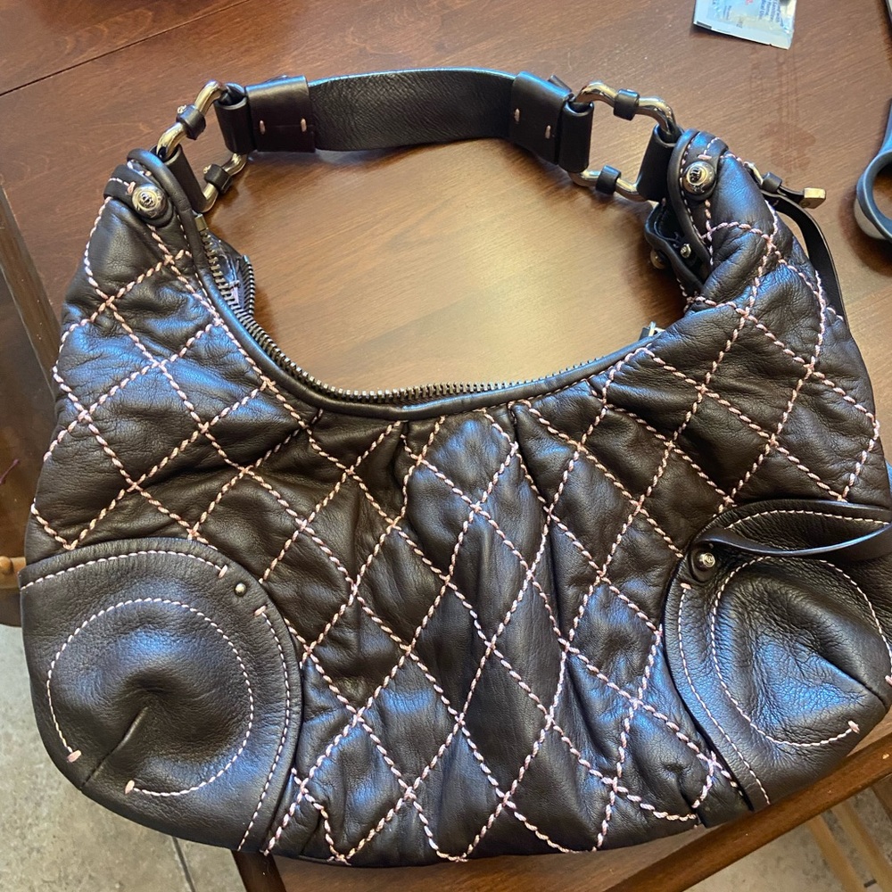 Vintage brown leather bag with pink stitching. Great condition